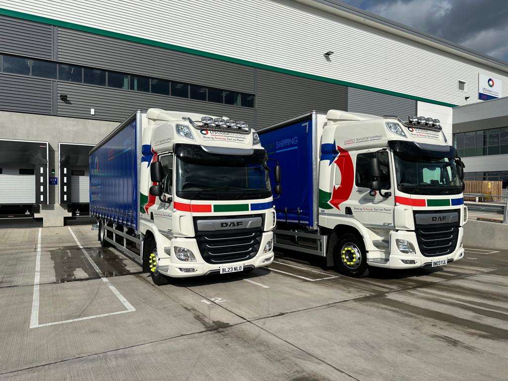 Image of two LTS vehicles parked outside our warehouse.