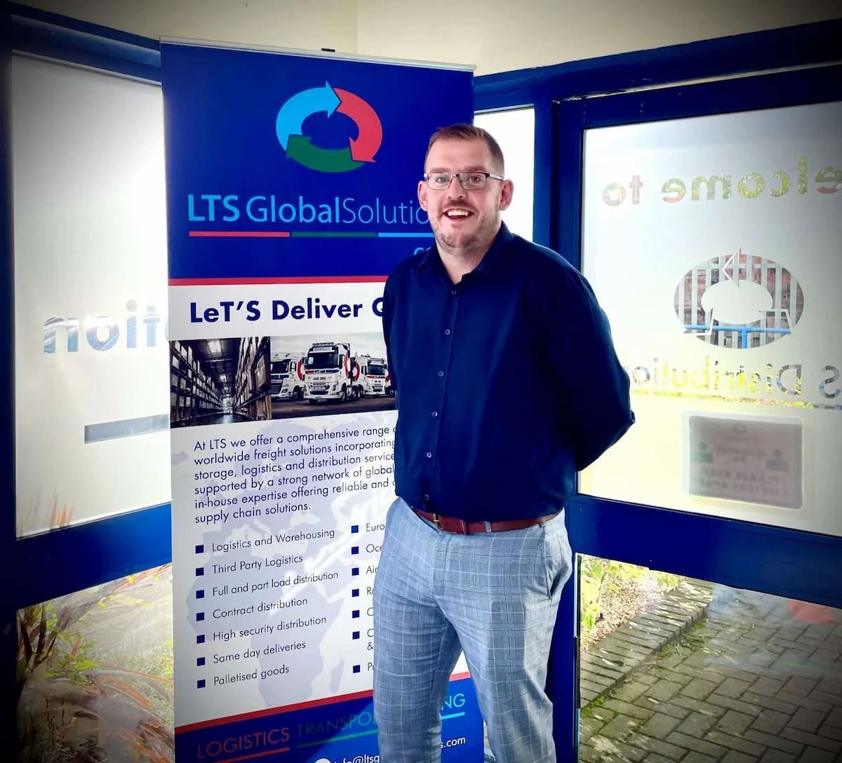 LTS general manager stood in front of LTS sign