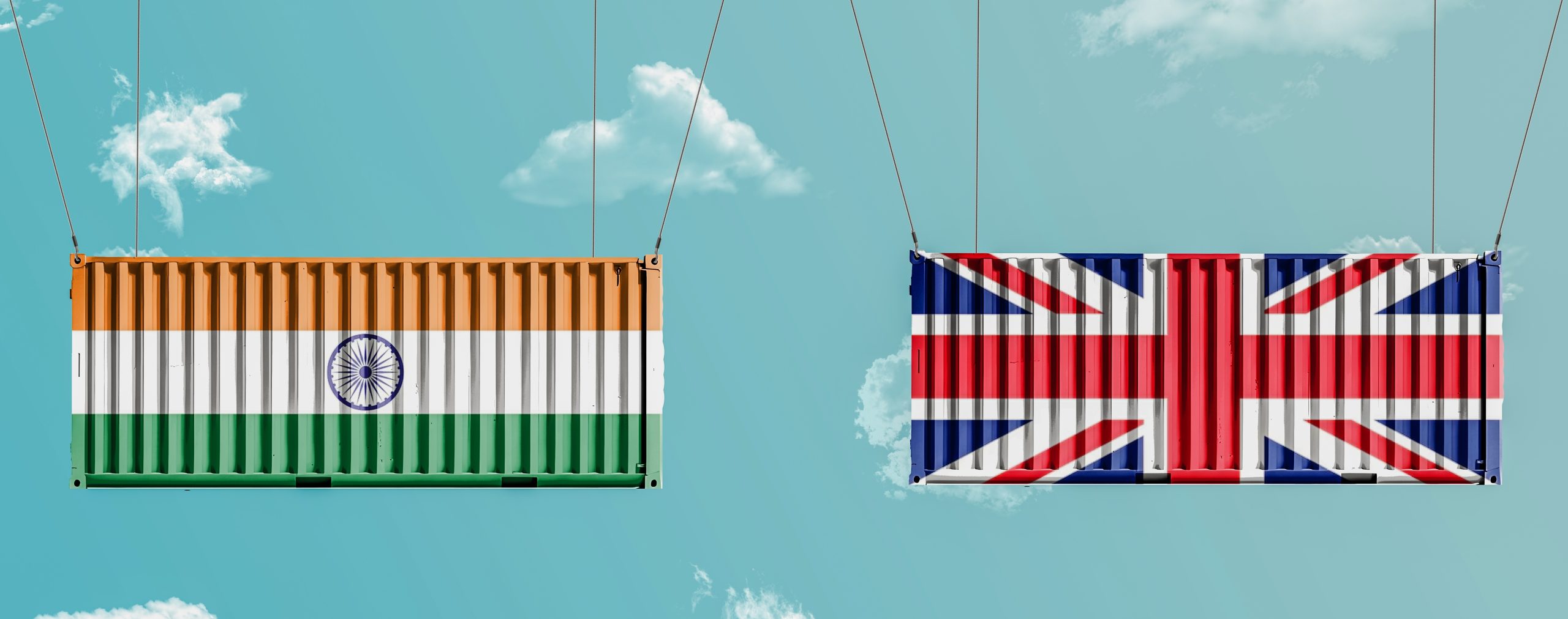 2 shipping containers one with Indian flag and the second with UK flag.