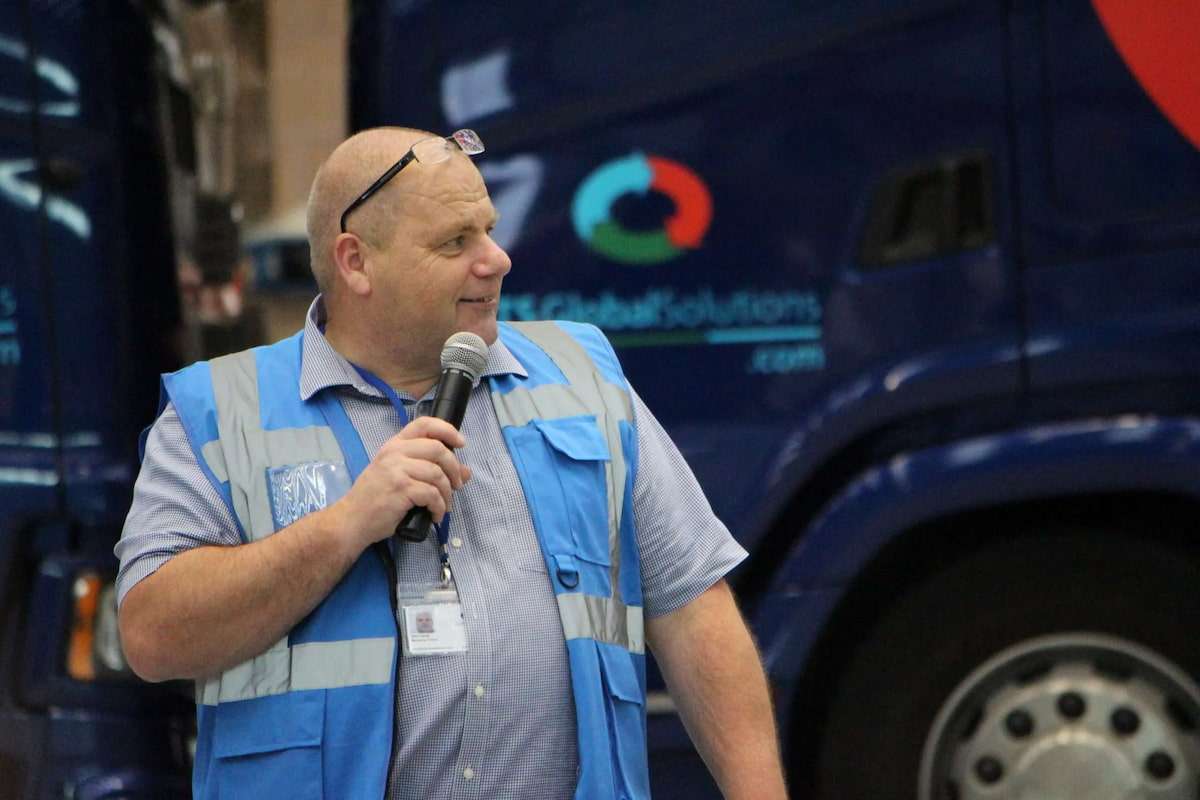 Managing-Director The Managing Director with a microphone and LTS truck in the background